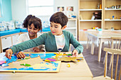 Students doing puzzle in classroom