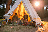 Students and teachers smiling at campsite