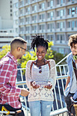 Friends talking on city street