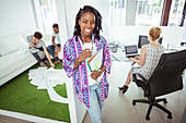 Woman drinking coffee in office