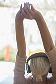 Woman stretching in headphones