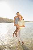 Grandmother holding granddaughter