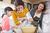 Three generations of woman baking