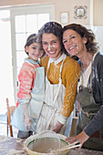 Three generations of women baking