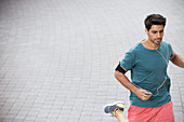 Man running through city streets