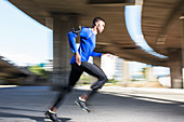 Man running through city streets