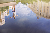 Reflection of woman stretching