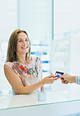 Woman paying with credit card