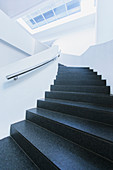 Black and white winding staircase curving