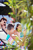 Family with two children sunbathing