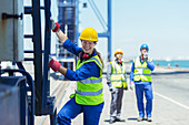 Worker climbing cargo crane