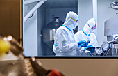 Scientists using tablets in experiment