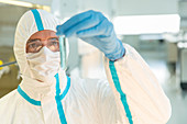 Scientist examining sample in test tube