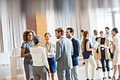 Business people standing in hall