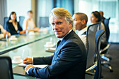 Businessman sitting at conference table