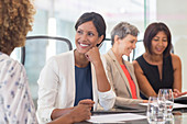 Four women sitting and talking