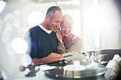 Older couple listening to vinyl records