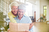 Older woman hugging husband