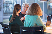 Businesswomen talking in office meeting