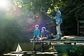 Boy fishing and playing