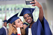 Students taking selfie after graduation