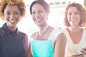 Portrait of three smiling businesswomen