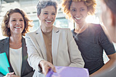 Three smiling businesswomen