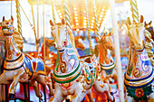 Carousel horses in amusement park