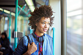 Woman looking out window of train