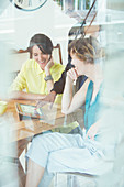 Office workers talking at desk