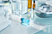 Syringe with blue fluid