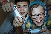 Boys playing video game