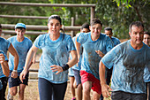 Team running in rain course