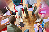 Group therapy session forming circle