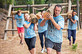 Determined people running with logs