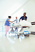 Doctors and nurse rushing patient