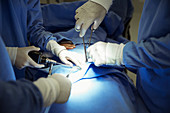Surgeons during surgery in operating room