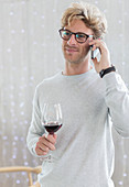 Man drinking red wine and talking