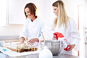 Chefs baking kneading dough