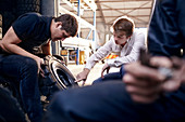 Mechanic and customer examining tire