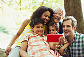 Family taking selfie in woods