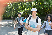 College students walking in park