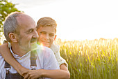 Grandson hugging grandfather