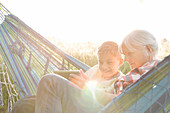 Grandmother and grandson in sunny hammock