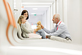 Doctor talking to girl patient
