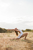 Boho woman in yoga pose