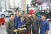 Mechanics with car engine