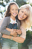 Grandmother and granddaughter hugging