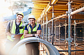 Portrait engineers at construction site