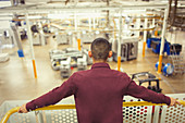 Supervisor looking out over factory